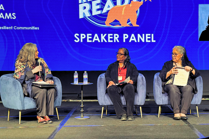 A top-down view of a festive autumn dinner featuring roast chicken, pumpkin pie, and various side dishes.