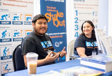 A female pastor delivers a sermon in an intimate church setting, engaging parishioners.