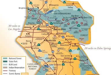 A vibrant scene of people raising hands to a large inflatable globe at a public event in Berlin.